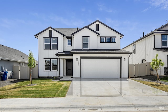 11514 W Julianna Ct, Nampa, ID 83651 - view of front facade featuring driveway, an attached garage, a shingled roof, and board and batten siding
