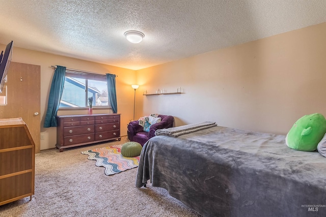 carpeted bedroom with a textured ceiling