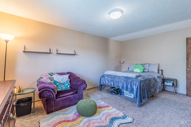 carpeted bedroom featuring baseboards and a textured ceiling