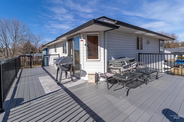 wooden deck featuring grilling area