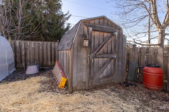 view of shed with a fenced backyard