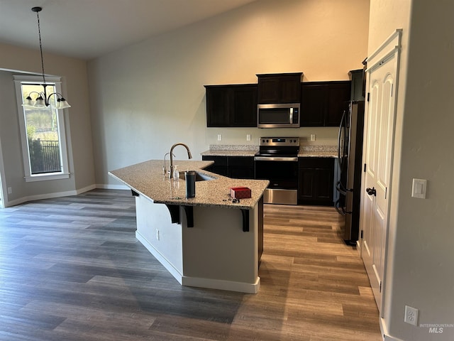 20447 N Glenisla, Boise, ID 83714 - kitchen with dark wood-style flooring, a sink, stainless steel appliances, and light stone countertops