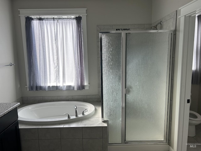 20447 N Glenisla, Boise, ID 83714 - full bath featuring a stall shower, toilet, vanity, and a garden tub