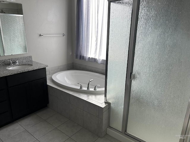 20447 N Glenisla, Boise, ID 83714 - bathroom with tile patterned flooring, vanity, a stall shower, and a garden tub