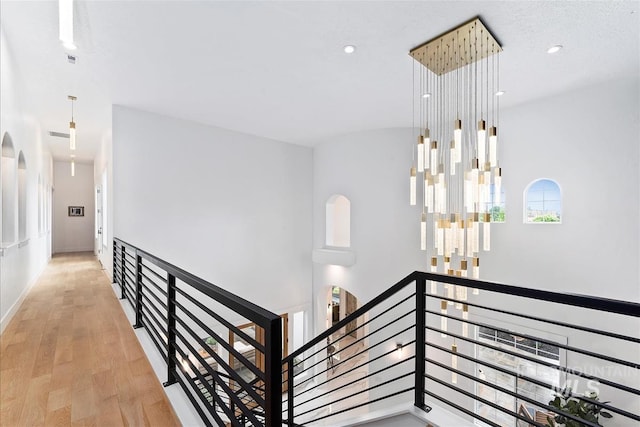 staircase featuring wood-type flooring