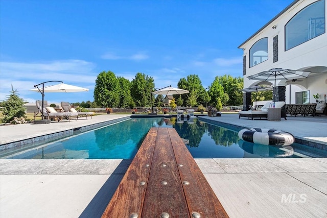 view of pool with a patio and outdoor lounge area