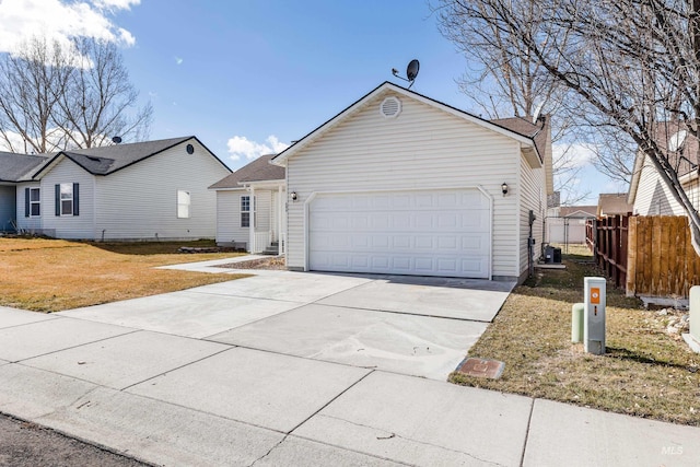 view of front of home featuring central air condition unit, a garage, fence, concrete driveway, and a front lawn