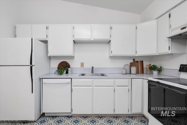 kitchen featuring white appliances, light countertops, under cabinet range hood, and a sink