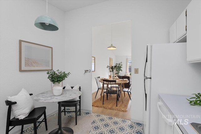 dining space featuring baseboards