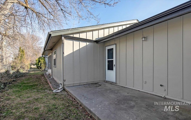 exterior space featuring a patio and board and batten siding