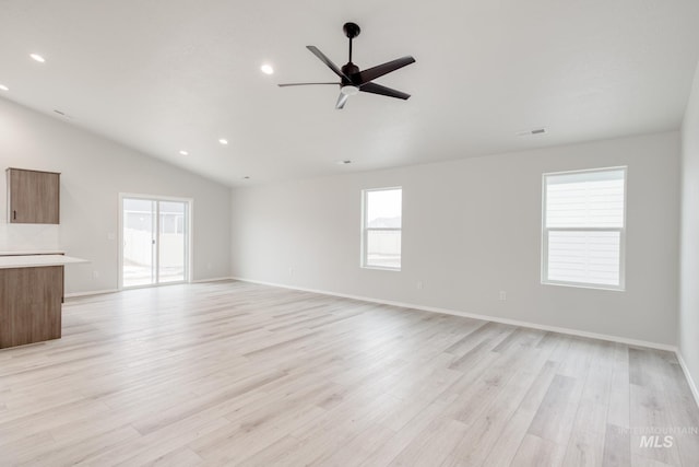 1516 N Coltsfoot Ave, Kuna, ID 83634 - unfurnished living room with lofted ceiling, healthy amount of natural light, light wood-type flooring, a ceiling fan, and recessed lighting