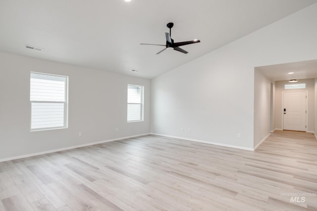 1516 N Coltsfoot Ave, Kuna, ID 83634 - spare room featuring vaulted ceiling, ceiling fan, light wood-style floors, and baseboards