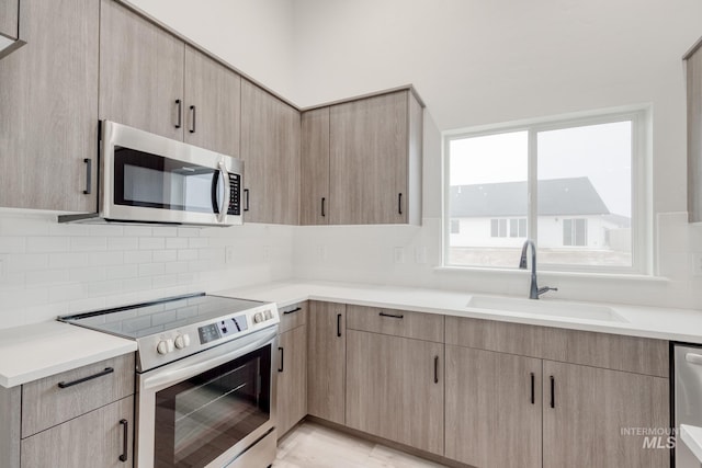 1516 N Coltsfoot Ave, Kuna, ID 83634 - kitchen featuring appliances with stainless steel finishes and light brown cabinets
