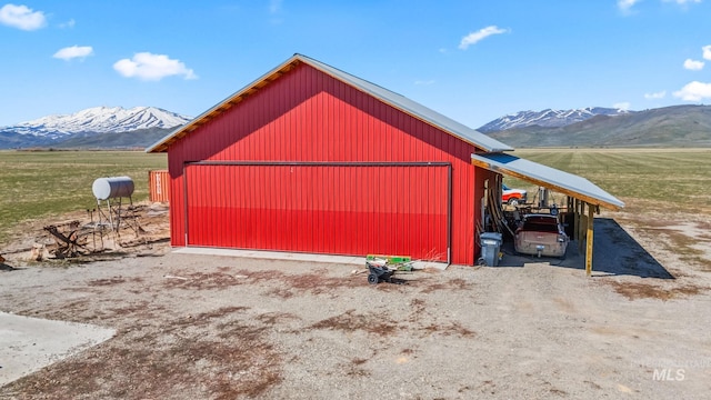 269 N 100 E, Fairfield, ID 83327 - garage featuring a mountain view and a carport