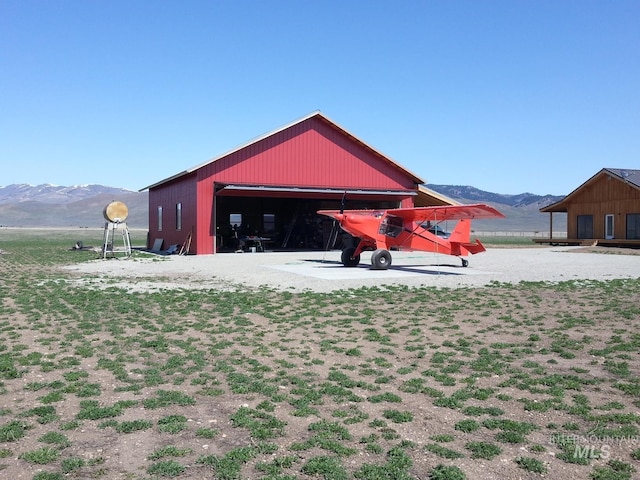 269 N 100 E, Fairfield, ID 83327 - view of property's community featuring a mountain view, an outdoor structure, and a garage