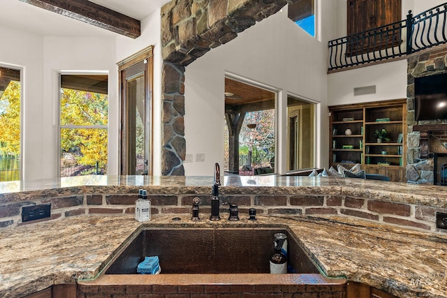 kitchen with beamed ceiling and sink