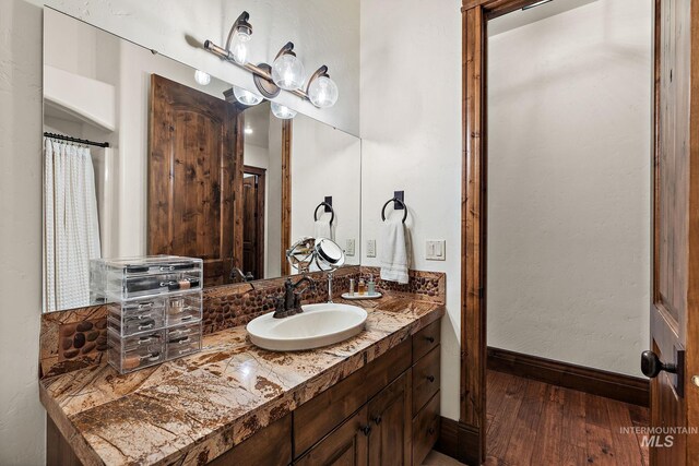 bathroom featuring vanity and hardwood / wood-style floors