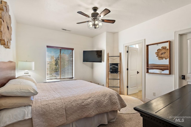 bedroom with ceiling fan and light colored carpet