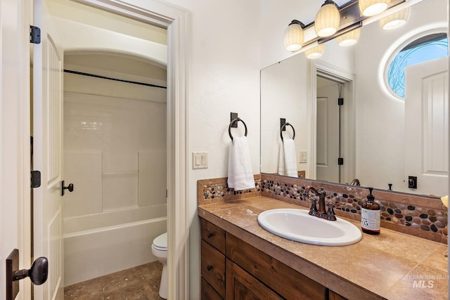 full bathroom with vanity, toilet, and bathtub / shower combination