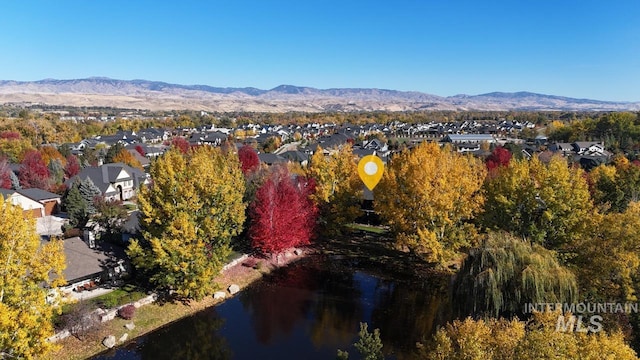 bird's eye view with a water and mountain view