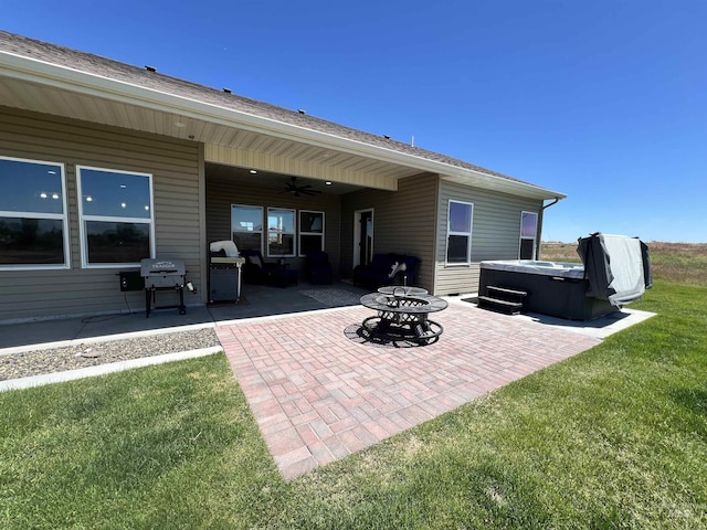 628 Pioneer Mountain Loop, Jerome, ID 83338 - view of patio featuring a hot tub, a ceiling fan, grilling area, and a fire pit