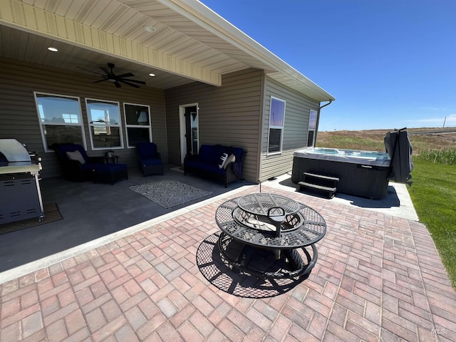628 Pioneer Mountain Loop, Jerome, ID 83338 - view of patio / terrace featuring a hot tub, a ceiling fan, and a fire pit