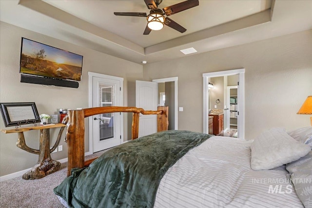 628 Pioneer Mountain Loop, Jerome, ID 83338 - carpeted bedroom featuring baseboards, a raised ceiling, connected bathroom, and a ceiling fan