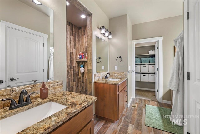 628 Pioneer Mountain Loop, Jerome, ID 83338 - full bath with wood finished floors, two vanities, and a spacious closet
