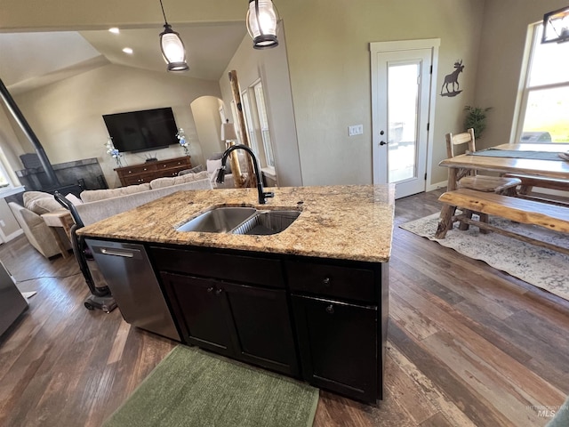 628 Pioneer Mountain Loop, Jerome, ID 83338 - kitchen with a sink, dishwashing machine, open floor plan, vaulted ceiling, and dark cabinets