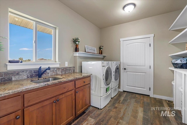 628 Pioneer Mountain Loop, Jerome, ID 83338 - washroom with washing machine and clothes dryer and dark wood-style flooring