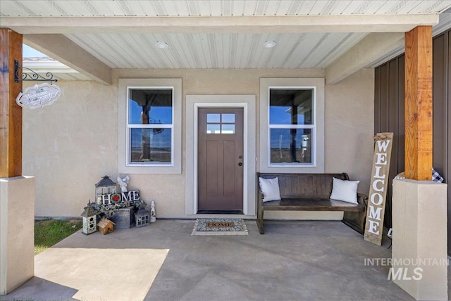 628 Pioneer Mountain Loop, Jerome, ID 83338 - property entrance featuring a patio and stucco siding