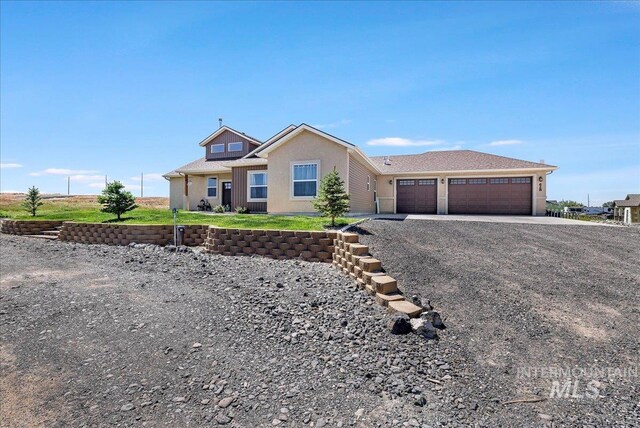 628 Pioneer Mountain Loop, Jerome, ID 83338 - ranch-style home featuring gravel driveway and an attached garage