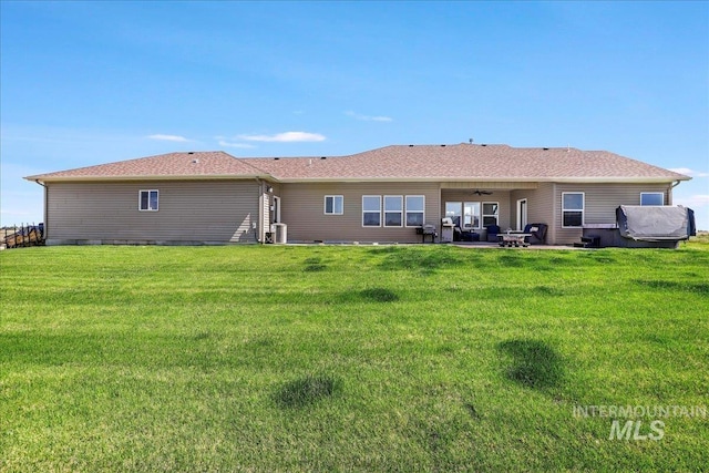 628 Pioneer Mountain Loop, Jerome, ID 83338 - rear view of house with ceiling fan, a patio area, a yard, and central AC unit