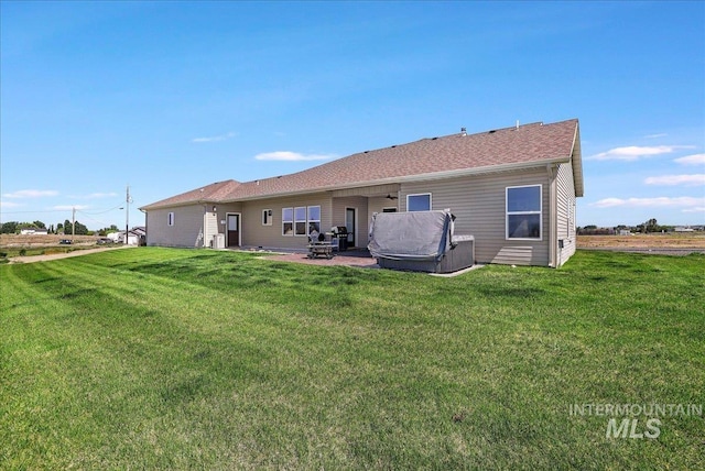 628 Pioneer Mountain Loop, Jerome, ID 83338 - rear view of property with a yard and a patio