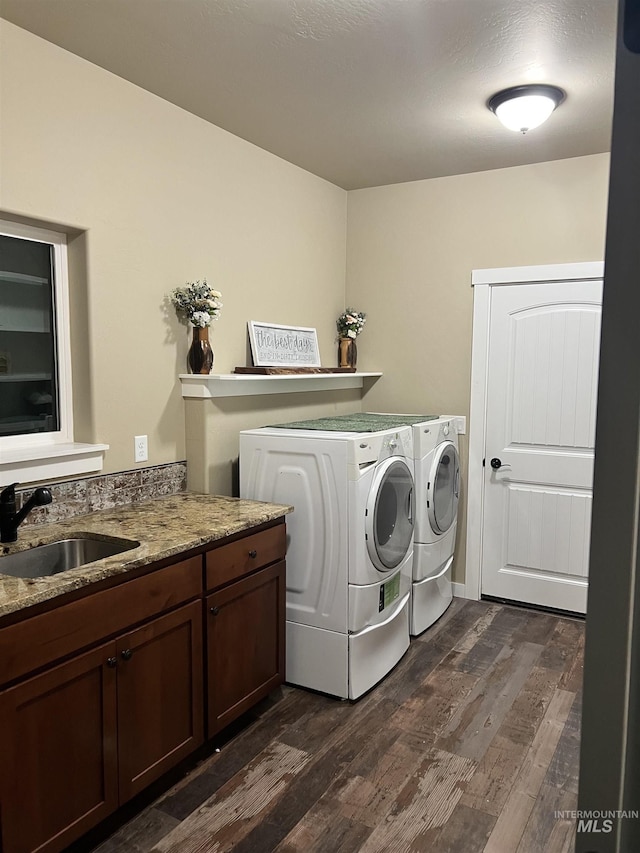 628 Pioneer Mountain Loop, Jerome, ID 83338 - laundry area with washing machine and clothes dryer, dark wood-style floors, and cabinet space