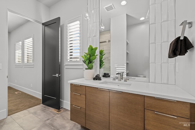 full bathroom with tile patterned flooring, visible vents, a wealth of natural light, and vanity