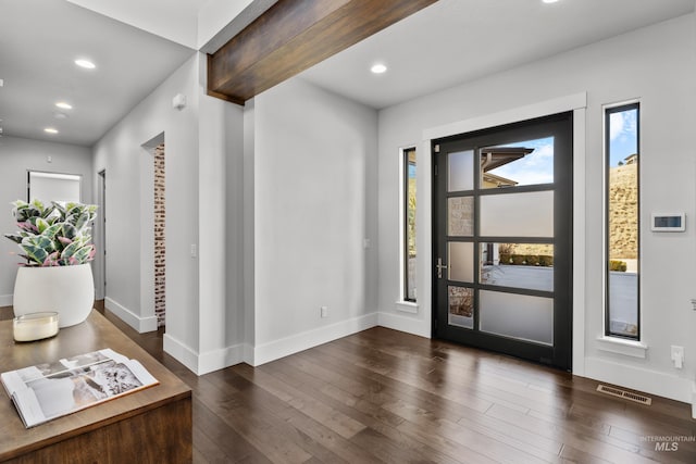 foyer entrance featuring dark wood-type flooring, recessed lighting, and visible vents