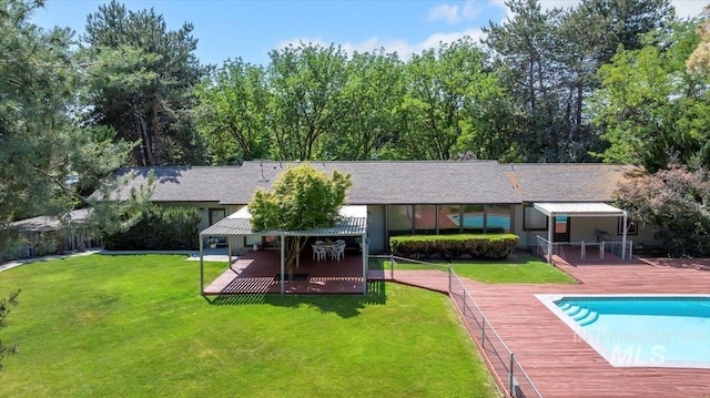3752 Lancer Way, Boise, ID 83713 - rear view of house featuring an outdoor pool, a lawn, a patio area, a wooden deck, and a shingled roof