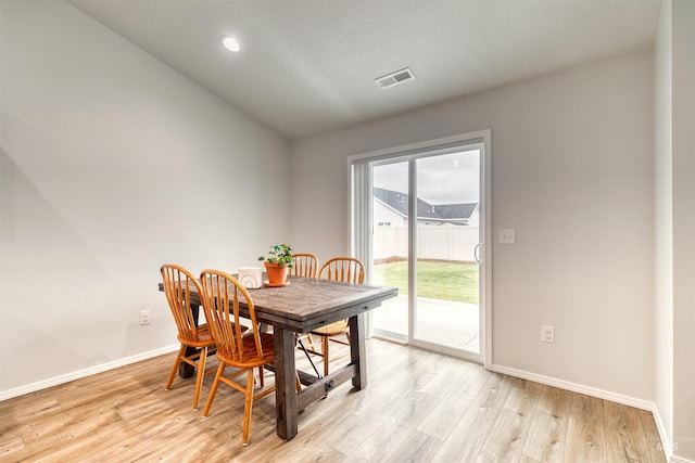 4913 Endicott Dr, Caldwell, ID 83605 - dining space featuring light wood finished floors and vaulted ceiling