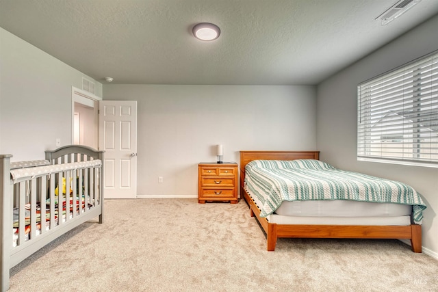 4913 Endicott Dr, Caldwell, ID 83605 - carpeted bedroom with a textured ceiling