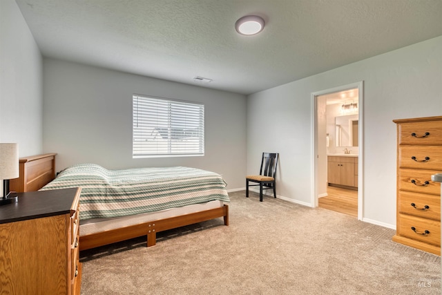 4913 Endicott Dr, Caldwell, ID 83605 - bedroom featuring light colored carpet and ensuite bathroom