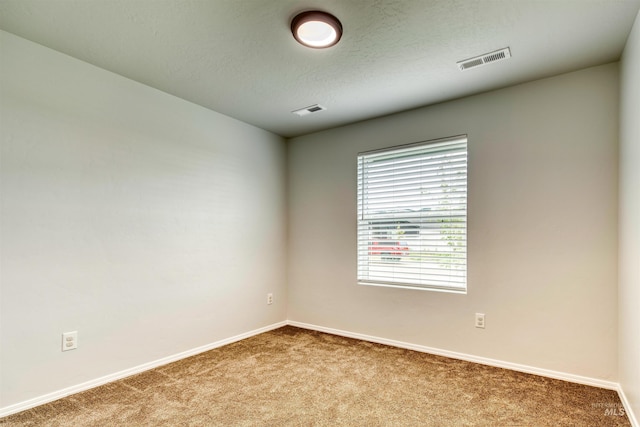 4913 Endicott Dr, Caldwell, ID 83605 - carpeted empty room with baseboards and a textured ceiling