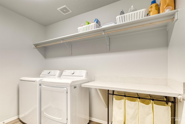 4913 Endicott Dr, Caldwell, ID 83605 - laundry area with washing machine and clothes dryer and baseboards