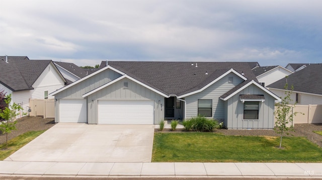 4913 Endicott Dr, Caldwell, ID 83605 - view of front of house with board and batten siding, an attached garage, concrete driveway, and roof with shingles