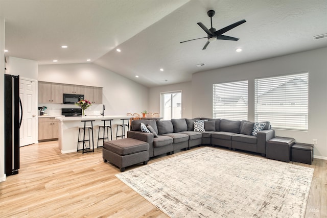 4913 Endicott Dr, Caldwell, ID 83605 - living area featuring light wood-style flooring, a ceiling fan, lofted ceiling, and recessed lighting