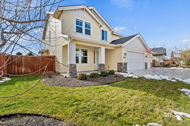 craftsman-style house with a garage and a front lawn