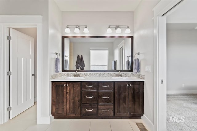 bathroom with vanity and tile patterned floors