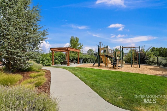 view of playground with a yard and a pergola