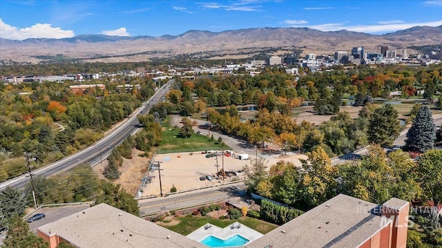 birds eye view of property with a mountain view