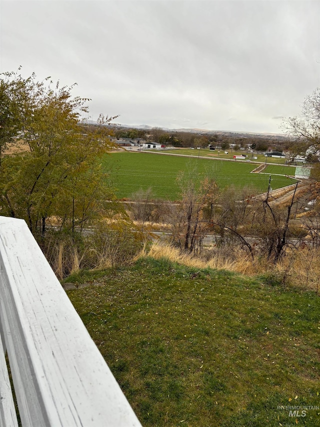 view of yard with a rural view